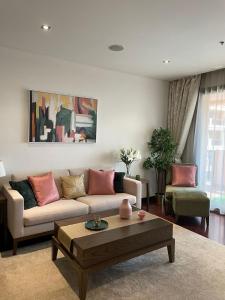 a living room with a couch and a coffee table at Anantara Luxury Hotel Apartment & Residences conected Anantara Hotel in Dubai