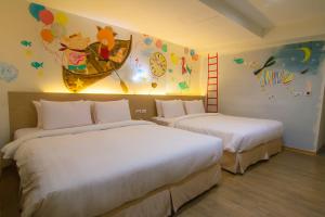 Postel nebo postele na pokoji v ubytování Legend Hotel Kaohsiung Liuhe