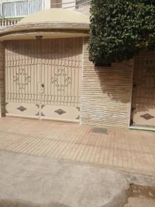 a garage with a gate on the side of a building at luxury villa in Agadir