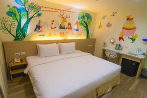 Postel nebo postele na pokoji v ubytování Legend Hotel Kaohsiung Liuhe