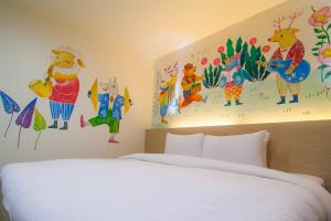 Postel nebo postele na pokoji v ubytování Legend Hotel Kaohsiung Liuhe