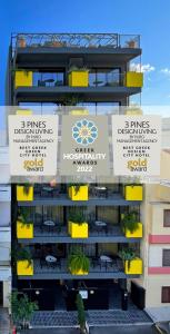 a building with signs on the side of it at 3 Pines Design Living in Heraklio Town