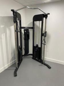 a room with a gym with angth at Brand new luxury apartment with free parking and gym in Olton