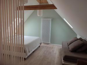 Letto o letti in una camera di Chambres et tables d'hôtes Cornec