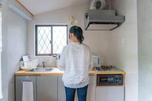 Una cocina o cocineta en 自然豊か棚田百選の棚田・道の駅・金剛山登山・釣り・ゴルフに便利/8名宿泊可広々一軒家/無料駐車場