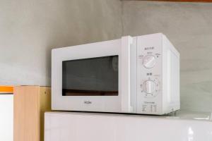 Una cocina o cocineta en 自然豊か棚田百選の棚田・道の駅・金剛山登山・釣り・ゴルフに便利/8名宿泊可広々一軒家/無料駐車場