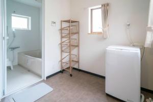 Una cama o camas en una habitación de 自然豊か棚田百選の棚田・道の駅・金剛山登山・釣り・ゴルフに便利/8名宿泊可広々一軒家/無料駐車場