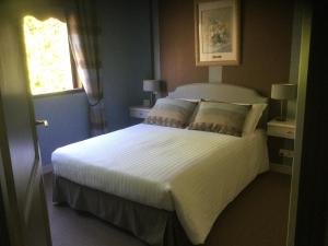 Кровать или кровати в номере Maison d’hôtes du Clos de Kério