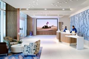 a rendering of a lobby with people working at computers at LUMA Hotel San Francisco in San Francisco +37 photos