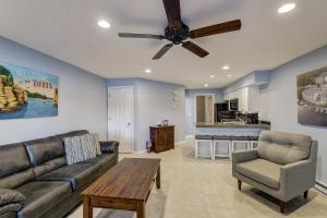 a living room with a couch and a ceiling fan at WFC Lakefront Views Family or Romance in Wisconsin Dells