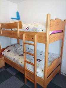 a pair of bunk beds in a room at Holiday Home Over The River in Bovec