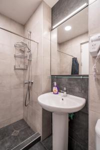 a bathroom with a sink and a shower at New Gudauri, Loft 1, Kato 236 in Gudauri