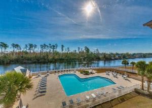 a swimming pool with a view of a river at 26i WWV Myrtle Beach Intracoastal Waterway Gem in Myrtle Beach