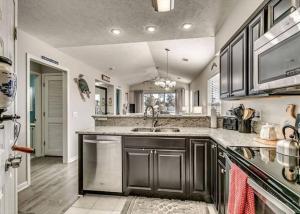 a kitchen with a sink and a counter top at 26i WWV Myrtle Beach Intracoastal Waterway Gem in Myrtle Beach
