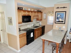 a kitchen with a sink and a stove top oven at Deerfield Plantation 217A2 in Myrtle Beach
