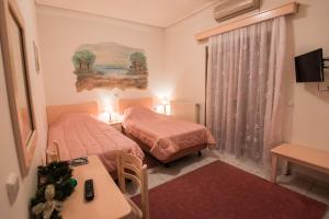 Postel nebo postele na pokoji v ubytování Artemis