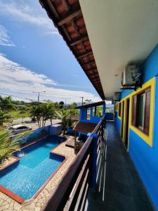 a view from the balcony of a house with a swimming pool at Pousada Retiro das Caravelas in Cananéia