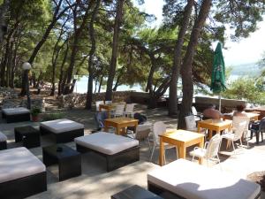 A restaurant or other place to eat at Apartments Dora, with a beautiful view of the bay, near the sea and center