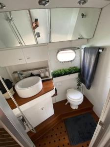 a bathroom with a sink and a toilet in an rv at Barco muy romantico con parking! in Barcelona