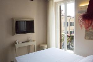 TV a/nebo společenská místnost v ubytování B&B Verona Centro