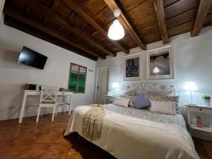 Кровать или кровати в номере La Piccola Maison