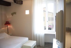 Postel nebo postele na pokoji v ubytování B&B Verona Centro