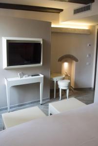 TV a/nebo společenská místnost v ubytování B&B Verona Centro