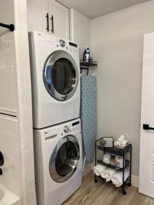 a washing machine and a washer in a bathroom at Guest Suites 1996 #4- Relaxing 1 bedroom 1 bath Suite in Idaho Falls