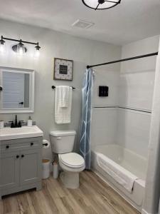 a bathroom with a tub and a toilet and a sink at Guest Suites 1996 #4- Relaxing 1 bedroom 1 bath Suite in Idaho Falls