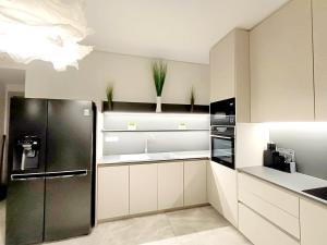 A kitchen or kitchenette at Luxury Apartment Nikiti Olea Valley