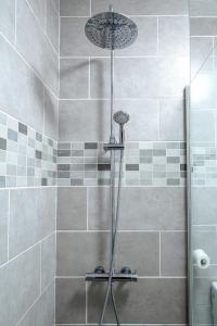 a shower with a shower head in a bathroom at Gorgeous Los Diamantes Home in Los Cristianos