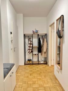 a room with a closet with a wooden floor at urbanstays Linz Landstraße - city center - near casino in Linz