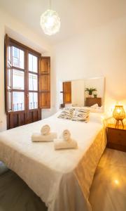 Posteľ alebo postele v izbe v ubytovaní Bonito y acogedor apartamento pleno centro junto Catedral