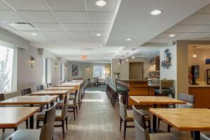 a dining room with wooden tables and chairs at Best Western Gregory Hotel in Brooklyn
