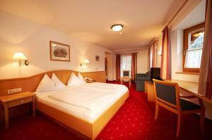 Posteľ alebo postele v izbe v ubytovaní Hotel Wagrainerhof
