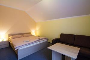 Postel nebo postele na pokoji v ubytování Apartmány Sport with Garage