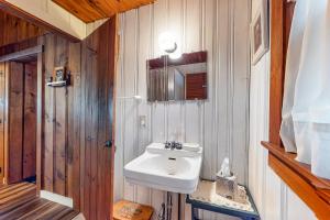 a bathroom with a white sink and a mirror at The Red Camp in Casco +40 photos