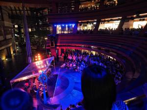 a crowd of people watching a concert in a building at Hotel New Gaea Domemae in Fukuoka