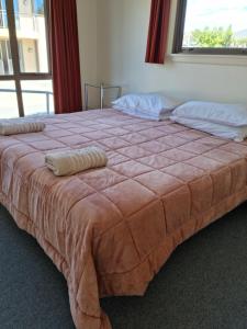 Postel nebo postele na pokoji v ubytování Methven Motel & Apartments