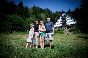 a group of people standing in a field at Hotel Tisa Pohorje in Pohorje