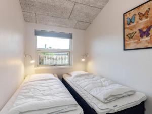 Postel nebo postele na pokoji v ubytování Holiday home Bogense XXXVI