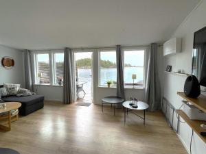 a living room with a couch and a table at Holiday home OSKARSHAM III in Oskarshamn