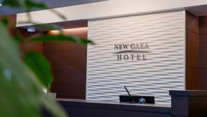 a wall with a new chicago hotel sign on it at Hotel New Gaea Kamigofuku in Fukuoka