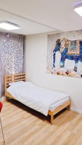 Cama o camas de una habitación en Agit Guesthouse