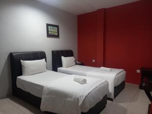 Postel nebo postele na pokoji v ubytování Reintree Lodge Hotel