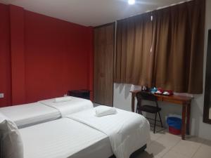 Postel nebo postele na pokoji v ubytování Reintree Lodge Hotel