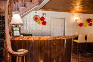 a bar in a hotel with red and green decorations at Canyons Boutique Hotel - A Canyons Collection Property in Kanab
