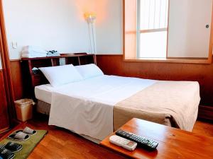 Postel nebo postele na pokoji v ubytování Hotel Harbor