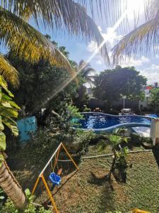 Bazén v ubytování Bonito departamento con alberca en Cancún nebo v jeho okolí