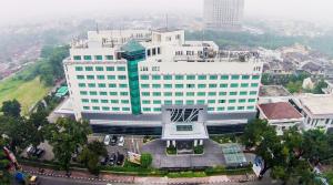 an overhead view of a large white building at Emerald Garden International Hotel in Medan